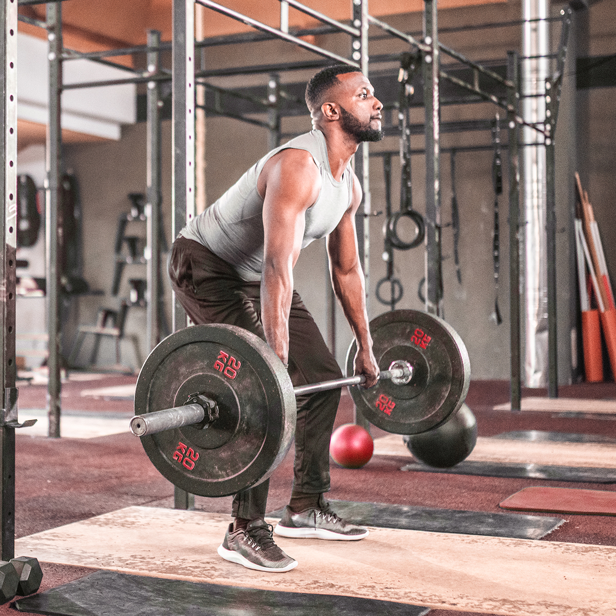 Student athlete in the gym doing deadlifts